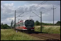 EN57 2059 mit einem Naverkehrszug s�dlich von Stargard am 09.09.2012.