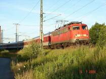 NZ aus Binz gezogen von der 115 336-0 kurz vor dem Rostocker Hbf. 14.7.06