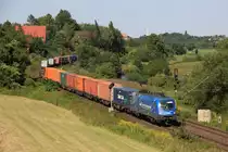 Mittelweserbahn (MWB) 1116 911-7 zieht am 14.08.12 einen Containerzug durch das Leinetal.
Festgehalten bei Elze.