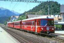 RhB Regionalzug 848 von Chur nach Thusis am 20.06.1998 in Domat Ems mit Steuerwagen voraus ABDt 1711 - B 2417 - B 2416 - Be 4/4 512. Hinweis: gescanntes Dia
