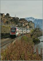 Eine kleine Fototour mit drei Spurweiten: 
Auf der Normalspur setzen seit dem Fahrplanwechsel die RE Gen�ve - Lausanne - Vevey neue Akzente im Lavaux; hier der 511 112 als RE 2720 bei St-Saphorin. 
23. Dez. 2012