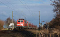 111 089-9 fuhr am 11.01.2013 mit einem RE von Emden nach Mnster, hier sdlich von Leer.