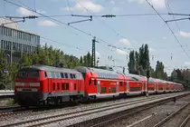218 428 schiebt am 17.8.12 einen RE durch M�nchen-Heimeranplatz.