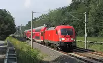 182 001-8 kommt hier am 07.07.2012 mit seinem RE2 nach Wismar �ber Berlin durch Bestensee gefahren. In wenigen Minuten erreicht der Zug den n�chsten Halt K�nigs Wusterhausen.