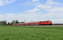 111 023-8 mit einem RE bei �bersee. Aufgenommen am 27. April 2013.