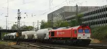 Die Class 66 DE6310  Griet  von Crossrail kommt aus Richtung Montzen/Belgien mit einem Kurzen Silozug aus Herentals(B) nach Poznen(PL) und f�hrt in Aachen-West ein bei Sonne mit Wolken am 28.4.2013.