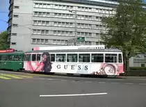 W�rend der Basel World macht der B 1452 Werbung f�r die Uhrenfirma GUESS. Hier f�hrt der B 1452 auf der Linie 14 zur Haltestelle Aeschenplatz. Die Aufnahme stammt vom 05.05.2013.
