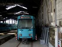 Ein VGF Ptb Wagen Nummer 712 steht am 08.06.13 in Eckenheim durch den Zaun fotografiert 