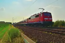 Gegenlichtaufnahme eines RE8 Verst�rkerzuges nach Kaldenkirchen fahrend bei Gubberath auf der Kbs 465 von der 111 120-2 geschoben. 9.7.2013