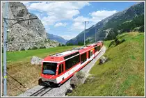 Der R240 hat den h�chsten Punkt der neuen Linienf�hrung fast erreicht. Links erkennt man den Schuttkegel des Bergsturzes von 1991. L�rchen und Birken erobern den Lebensraum zur�ck und haben nach 20 Jahren wieder eine beachtliche H�he erreicht. (04.08.2013)