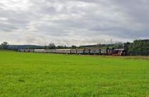 Die Reutlinger Zahnrad Dampflok 97 501 die dem Verein(Freunder der Zahradbahn Honau-Lichtenstein ZHL)geh�rt f�hrt den Sonderzug auf der Schw�b.Waldbahn nach Welzheim.Das Bild entstand bei dem kleinen Ort Miedelsbach am 8.9.2013.Am Zugschlu� l�uft eine V 60 der ESG mit um ein Umsetzen der Dampflok in Welzheim zu vermeiden.