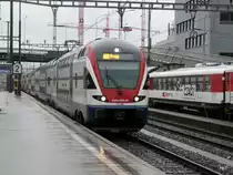 SBB - Triebzug RABe 511 002-3 unterwegs auf der S12 im Bahnhof Z�rich Altsetten am 16.09.2013