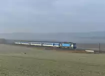 754 058 mit einem R nach Prag am 03.01.2014 bei Petrovice nad Uhlavou.