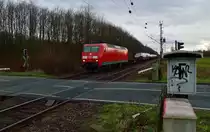 Mit einem gemischtem Güterzug ist hier die 145 046-9 bei trübem Wetter in Worringen gen Neuss fahrend unterwegs. 8.2.2014