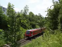 Am 11.7.13 war 611 021 auf dem Weg nach Stuttgart Hauptbahnhof. Vor wenigen Minuten verließ der Zug den Mössinger Bahnhof. 
Aufgenommen bei Mössingen. 