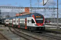 RABe 511 119 durchfährt den Bahnhof Muttenz. Die Aufnahme stammt vom 09.02.2014.