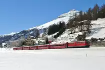 ENGADIN SKIMARATHON 2014: Ge 6/6 II 707 mit Extrazug 2342 Samedan-Vereina-Landquart bei Ausfahrt in Samedan, 09.03.2014.