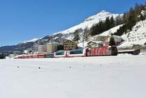 Ge 4/4 III 642  RhB Team   mit dem RE 1140 zwischen Samedan und Bever, 09.03.2014.