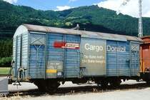 RhB - Gbk-v 5502 am 08.06.1997 in Landquart Ried - Gedeckter G�terwagen 2-achsig mit 1 offenen Plattform CARGO DOMIZIL gelber Aufkleber Reserviert f�r HOWAG - Baujahr 1911 - LOUV/RhB - Gewicht 6,94t - Zuladung 12,00t - L�P 8,49m - zul�ssige Geschwindigkeit Aufkleber 80 km/h - �2=21.01.1988 - Beschriftung: deutsch - Lebenslauf: ex K1 5502 - 1969 Gbk 5502 - 1979 Gbk-v 5502 - Hinweis: ge�nderte Zuladung, ge�nderte Geschwindigkeit, �nderung der Reservierung, gescanntes Dia
