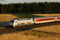 Porträtaufnahme von 101 016-4  dertour  im letzten Abendlicht am CNL 472 Basel-Kopenhagen bei Graben-Neudorf, 26.06.2014.