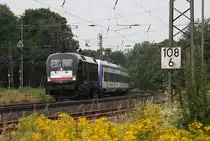 Taurus ES 64U2-034 mit dem HKX 1801 nach Hamburg / Westerland am 5.7.2014 bei der Durchfahrt in Hasbergen. Der Zug besteht neben dem Taurus aus einer reinen NOB Garnitur.
