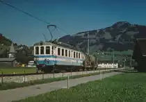 MOB/RBS: Zementverkehr Montreux-Saanen im Juli 2003. Die Zufuhren der beladenen Zementwagen ab Montreux sowie die Abfuhren des Leermaterials ab dem Bahnhof Saanen wurden jeweils den Regionalzügen mitgegeben. Das Rangiermanöver um Saanen wurde mit einem alten in Saanen stationierten Triebwagen abgewickelt. Rangierfahrt bei Saanen mit dem BDe 4/4 37 ex RBS/VBW  BLAUES BAEHNLI .
Foto: Walter Ruetsch