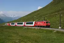 HGe 4/4 II 107 zieht am 19.07.2014 den GEX 900 von Andermatt Richtung Oberalppass, aufgenommen oberhalb von Nätschen.