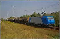 CFL Cargo 185 520-4 mit einem Kesselwagen-Zug am 16.09.2014 durch die Berliner Wuhlheide (NVR-Nummer 91 80 6185 520-4 D-CFLCA)