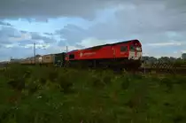 Die Crossrail DE 6301 ist im strömenden Regen bei Wickrathhahn auf der Kbs 485 gen Aachen fahrend abgelichtet am Abend des 11.10.2014