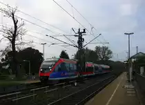 Die Euregiobahn (RB20) kommt aus Langerwehe-Stolberg-Altstadt nach Heerlen(NL) aus Richtung Aachen-West,Laurensberg,Richterich und hält in Kohlscheid und fährt in Richtung Herzogenrath. 
Bei Sonne und Wolken am Morgen vom 23.10.2014.