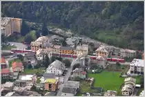 BEX 960 mit einem Allegra ABe 8/12 ist unterwegs am Stadtrand von Tirano und wird in Kürze die Schweizer Grenze bei Campocologno erreichen. (25.10.2014)
