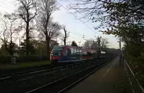 Die Euregiobahn (RB20) kommt aus Langerwehe-Stolberg-Altstadt nach Heerlen(NL) aus Richtung Aachen-West,Laurensberg,Richterich und hilt in Kohlscheid und fährt in Richtung Herzogenrath. 
Bei schönem Herbstwetter am Morgen vom  14.11.2014.