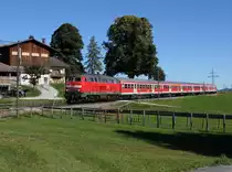Die 218 469 mit einem RE nach Füssen am 09.10.2014 unterwegs bei Seeg.