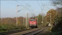 Der Sonne entgegen! Die 111 009-7 mit dem Wupperexpress (RE4) am Haken,unterwegs bei Rimburg auf der Kbs 485 am 22.11.2014.