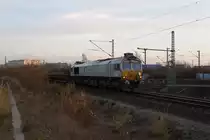 Die Mühldorfer 247 057-3 wurde u.a. am 24.11.14 im Münchner  Dunstkreis  eingesetzt und beförderte Nahgüterzüge. Morgens hatte sie im Rbf München-Süd einen beladenen Altschotterzug am Haken. Hier bei München-Laim beförderte sie gerade den entladenen Zug in nördlicher Richtung.