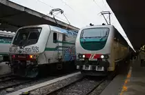 Hier links 464.263 mit R12254 von Roma Termini nach Civitavecchia und rechts  403.018 und im Hintergrund IC561 von Roma Termini nach Reggio di Calabria Centrale, diese beiden Züge standen am 24.12.2014 in Roma Termini.