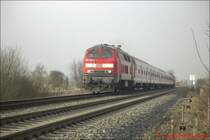 BR 218 252-5 f�hrt mit einer Regional Bahn im Fr�hjahr 2003 auf dem Weg von Heide nach Itzehoe aus Meldorf.