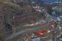 Re 4/4 II 11172,Re 4/4 II 11359 und die Re 4/4 II 11176 fahren bergwärts mit einem kurzen Güterzug auf der 1.Ebene in Wassen.Bild vom 19.2.2015