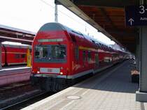 Dosto-Steuerwagen der Gattung DABbuzf 777 mit dem RE 3 Stralsund - Belzig im Stralsunder Hbf. Von dieser Art Steuerwagen gibt es effektiv nur noch 12 St�ck bundesweit! Wer wei� wie lange sie noch im Regionalverkehr zu sehen sind!? (12.06.03)