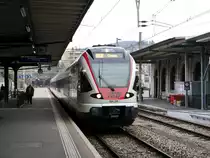 SBB/TILO - Einfahrt des Triebwagen RABe 524 114 im Bahnhof Lugano am 27.02.2015