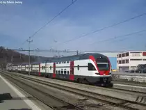 RABe 511 026 am 28.3.2015 als RegioExpress nach Olten in Wettingen