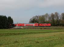 Eine 111 mit einem RE nach Salzburg am 21.04.2013 unterwegs bei Stephanskirchen.