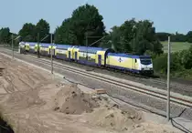 146 534 mit MEr 81619 (Hamburg-Harburg–L�neburg) am 06.07.2013 zwischen Winsen (Luhe) und Radbruch; das neue 3. Gleis ist oberbautechnisch fertiggestellt, von der Oberleitung stehen erst die Masten.