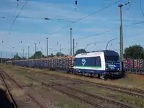 Die bereits mit Holz beladene Wagen wurden,am 26.Juni 2015,von der IntEgro 223 153 in Bergen/Rügen gesammelt.