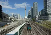 6418 departs Toronto with train 83, 1635 Toronto Union-London, 6 Aug 2015.

The CN Tower is in the background.