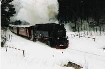 Am Waldgasthaus Drei Annen f�hrt die 99 7238 mit ihrem ersten Brockenzug des Tages vorbei. Januar 2003