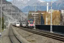 Begegnung eines IR Dosto nach Chur mit dem gerade ausfahrenden ICE nach Hamburg bei der Station Chur-Wiesental(man beachte die Spiegelung des ICE im IR Doppelstockzug)30.12.15