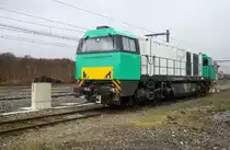272 403-7 von Railtraxx steht auf dem Abgstellgleis in Montzen-Gare(B). Aufgenommen in Montzen-Gare(B). 
Bei Schneeschauerwolken am Kalten Mittag vom 16.1.2016.