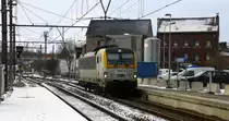 SNCB 1884  kommt als Lokzug aus Welkenraedt(B) und fährt in den Bahnhof von  Welkenraedt(B) ein.
Aufgenommen am Bahnhof von Welkenraedt(B). Bei Schnee und Sonne am Kalten Nachmittag vom 17.1.2016. 