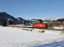 Die 1116 280 mit einem EC am 30.01.2016 unterwegs bei Kitzbühel Schwarzsee.